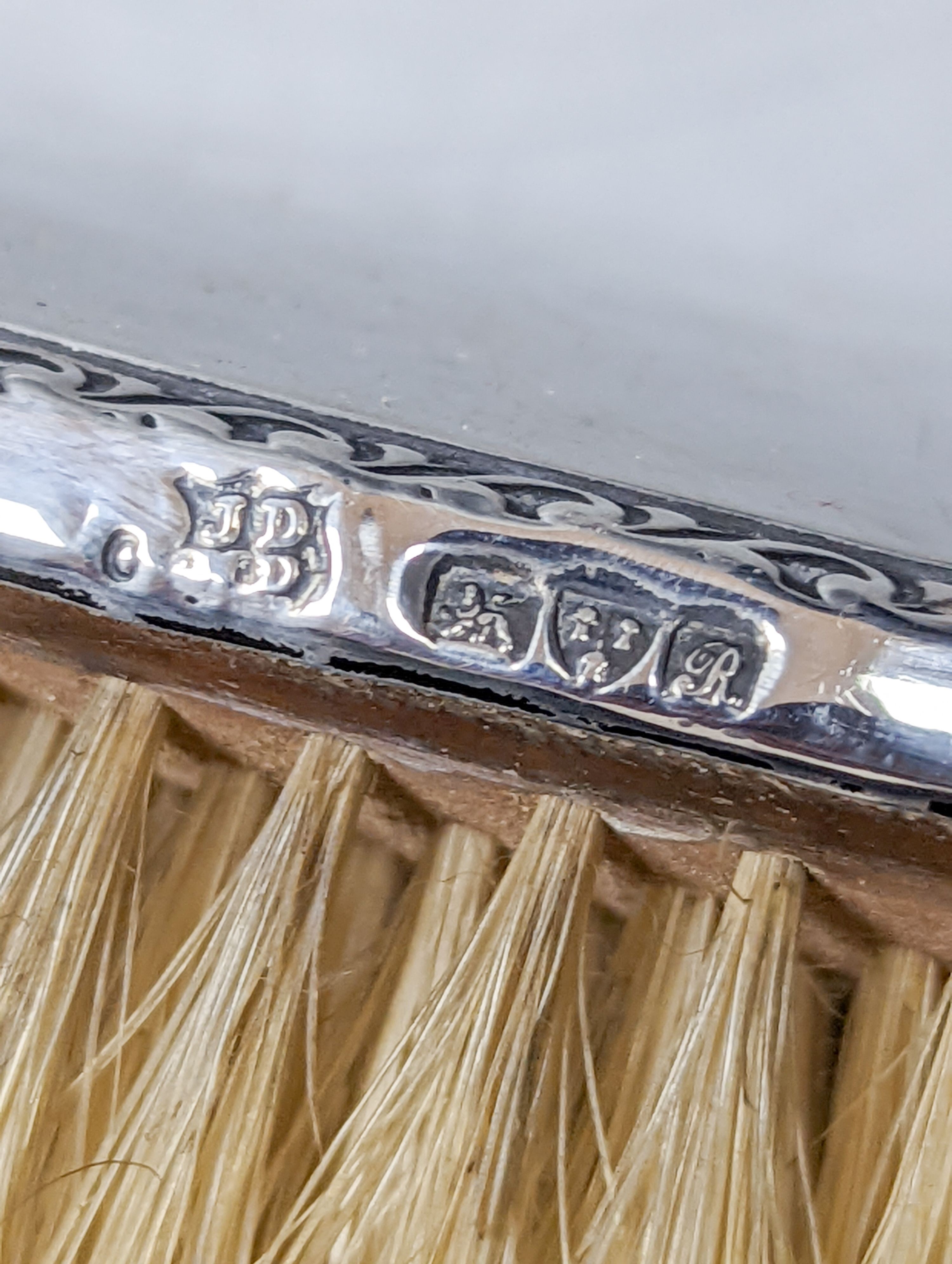 A George V silver mounted four piece mirror and brush set, Chester, 1917.